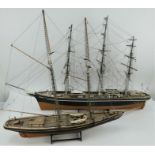 Two hand built wooden model fully rigged sailing ships.