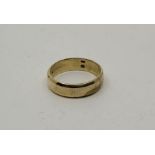 A 14ct. yellow gold band, size approx. UK L 1/2. (4.1g)