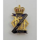 MILITARY INTEREST: A 9ct. gold and cloisonne enamel 13th 18th Royal Hussars brooch, by Garrard &