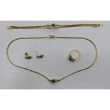 An 18ct. gold, diamond and emerald necklace, bracelet, ring and drop earrings en suite, having