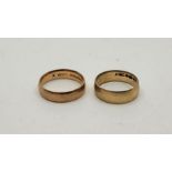 Two 9ct. yellow gold bands, Sizes UK K 1/2 & J. (total 4.5g). (2)