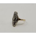 A 15ct. gold and diamond set ring, having pierced navette form head bezel set round cut diamond to