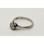 A platinum diamond solitaire ring, claw set round brilliant cut diamond to centre (EDW 0.45 carats),