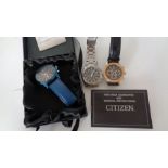 Three Gentlemen's wrist watches comprising a Citizen Echo Drive, a Cadisen blue with a leather strap