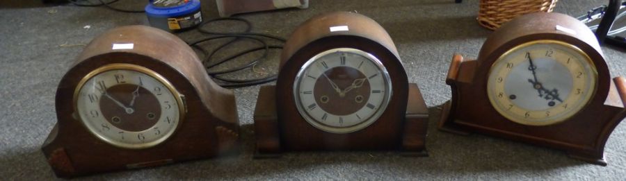 Tree 1940's mantel clocks in arched oak cases