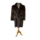 A good quality vintage men's fur coat, high gloss chocolate musquash. Double breasted C1970s. 48