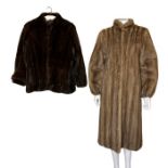 A honey mink fur coat with mandarin collar and swagger back. the sleeves being fitted to the