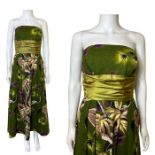 A 1950s strapless dress by Marldena. Made from a tropical floral bark cloth fabric with green