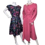 two vintage 1950s day dresses, the first in a floral print in shades of teal and purple and