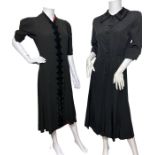 A 1930s dress in a black crepe with basket weave effect, red accents and velvet rouleau trim, a