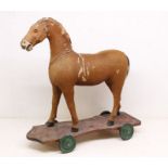 Horse: An early 20th century horse, with pony skin and horse hair, glass inset eyes, mane lacking,