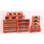 Hornby: A collection of fifteen assorted boxed Hornby, OO Gauge rolling stock and coaches, including