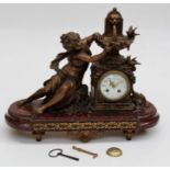 A 19th century French bronze, patinated spelter and rouge marble mantle clock ' La Fountaine aux
