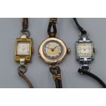 Three 1930's ladies cocktail watches, one in 9ct gold with a gold face and Roman numerals (winds but