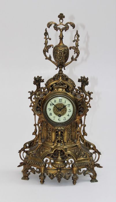 J Leemans, a circa 1900 ornate cast brass cased mantle clock, with ivorine Arabic dial. 57cm high