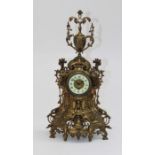 J Leemans, a circa 1900 ornate cast brass cased mantle clock, with ivorine Arabic dial. 57cm high