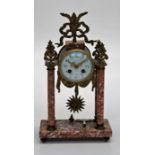 A late 19th century French gilt metal mounted and varigated rouge marble portico clock. The eight
