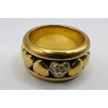 A 1997 Piaget heart shaped 18ct gold spinner ring. Featuring a heart set with Melee diamonds.