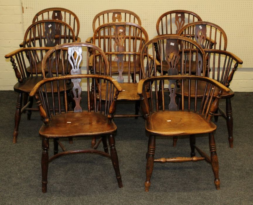 A harlequin set of eight 19th century beech and elm double hoop and stick back Windsor armchairs,