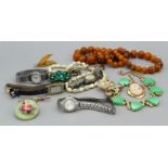 A selection of vintage costume jewellery featuring a copal bead necklace, a gold on silver