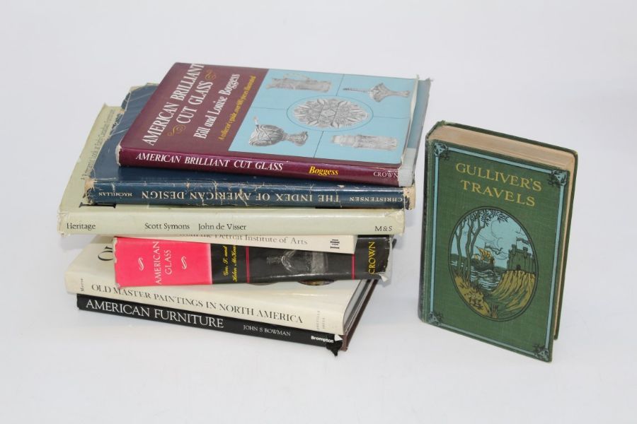 A small library of books, volumes include North America arts and design, Ornithology, museum guides,