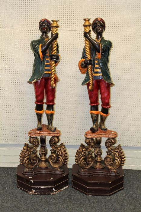 A pair of carved wood, gesso and polychrome painted Blackamoors, Italian, early 20th century. Each