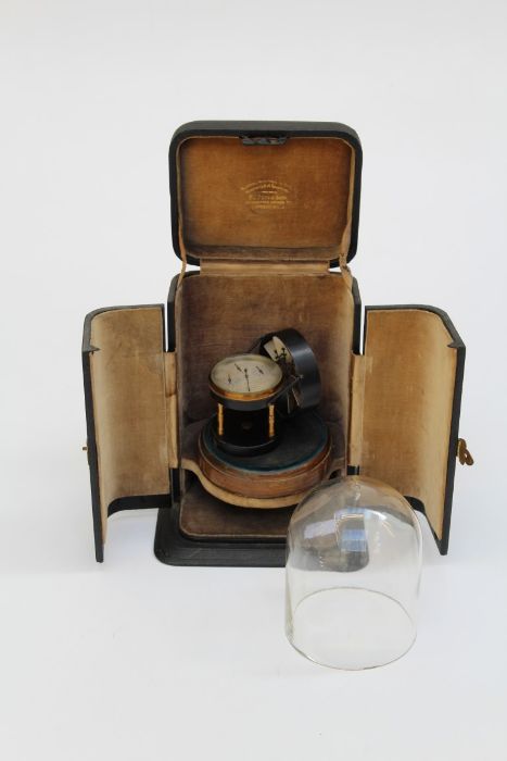 An Edwardian E R Watts and Sons Air Meter, on a wood base, beneath glass dome in a fitted case