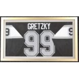 Ice Hockey: A framed and glazed, signed Wayne Gretzky shirt, signature faded, complete with