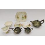 A 1930s Shelley part-tea set, together with an Arts & Crafts three-piece pewter tea set