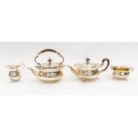 A George V silver four piece tea set comprising teapot, kettle, milk jug and sugar bowl, circular