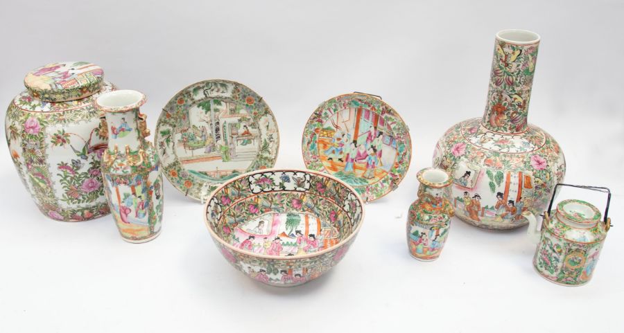 A collection of early 20th Century Famille Rose bowls, vases, Saki pot, plates, etc including a