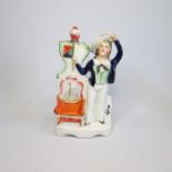 A Staffordshire pottery figure of a young Prince of Wales standing by a chair with a coronet