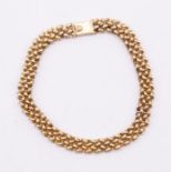 A 9ct gold fancy link bracelet, comprising interwoven links, width approx 7mm, with box clasp,