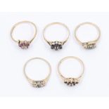 A collection of five stone set 9ct gold dress rings, to include two sapphire clusters, sizes N and