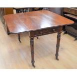 A reproduction mahogany Pembroke table on turned legs and castors along with a modern cane-work type