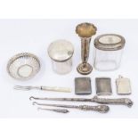 A collection of silver to include; two lidded vanity/toilet bottles, both hallmarked London, a