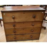 A 19th Century mahogany chest of three drawers with top section secretaire, original knob handles