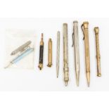 A collection of early 20th century pencils to include a gilt metal seal topped pencil by Sampson