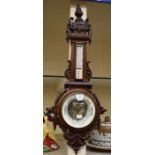 Late 19th century oak wall barometer with heavily carved detail