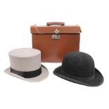 A top hat and a bowler hat in a case