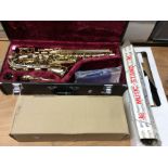A Yamaha gold plated saxophone cased. Model YAS25