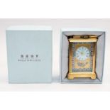 Halcyon Days - a boxed enamel clock, decorated in a floral design