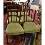 A set of 6 Hepplewhite-style dining chairs in the George III manner.