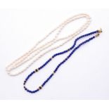 A lapis lazuli and gold bead necklace, comprising round beads approx 4mm, with popcorn style gold