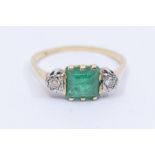 An emerald and diamond 18ct gold ring, comprising a square cut emerald to the centre approx 7mm,