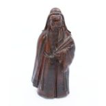 A modern resin figure of An Oriental Man wearing a robe, with book in hand. Detailed engravings to