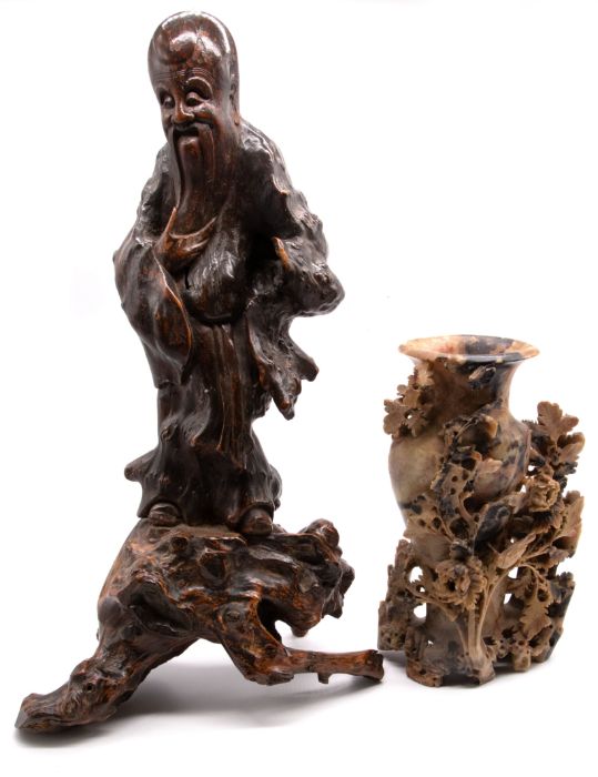 An early 20th Century hardwood figure of a Chinese deity along with a soapstone carved feature