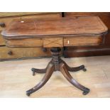 A mid-19th century mahogany folding tea table on four splayed legs and castors with ebonised banding