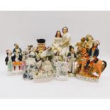 A collection of various Staffordshire and Continental ceramic figures to include; A large