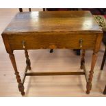 An early 20th century oak bookcase, together with an oak hall table with a single drawer, and a
